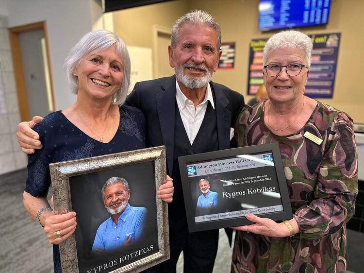 Kypros Kotzikas being honoured with a framed photo and certificate at the Addington Harness Hall of Fame ceremony